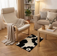Alfombra Flores Noir en dormitorio ambiente cálido